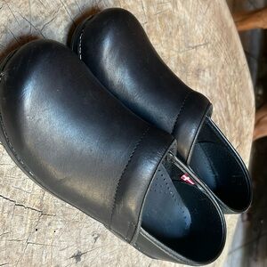 Brand new Sanita black leather clogs.